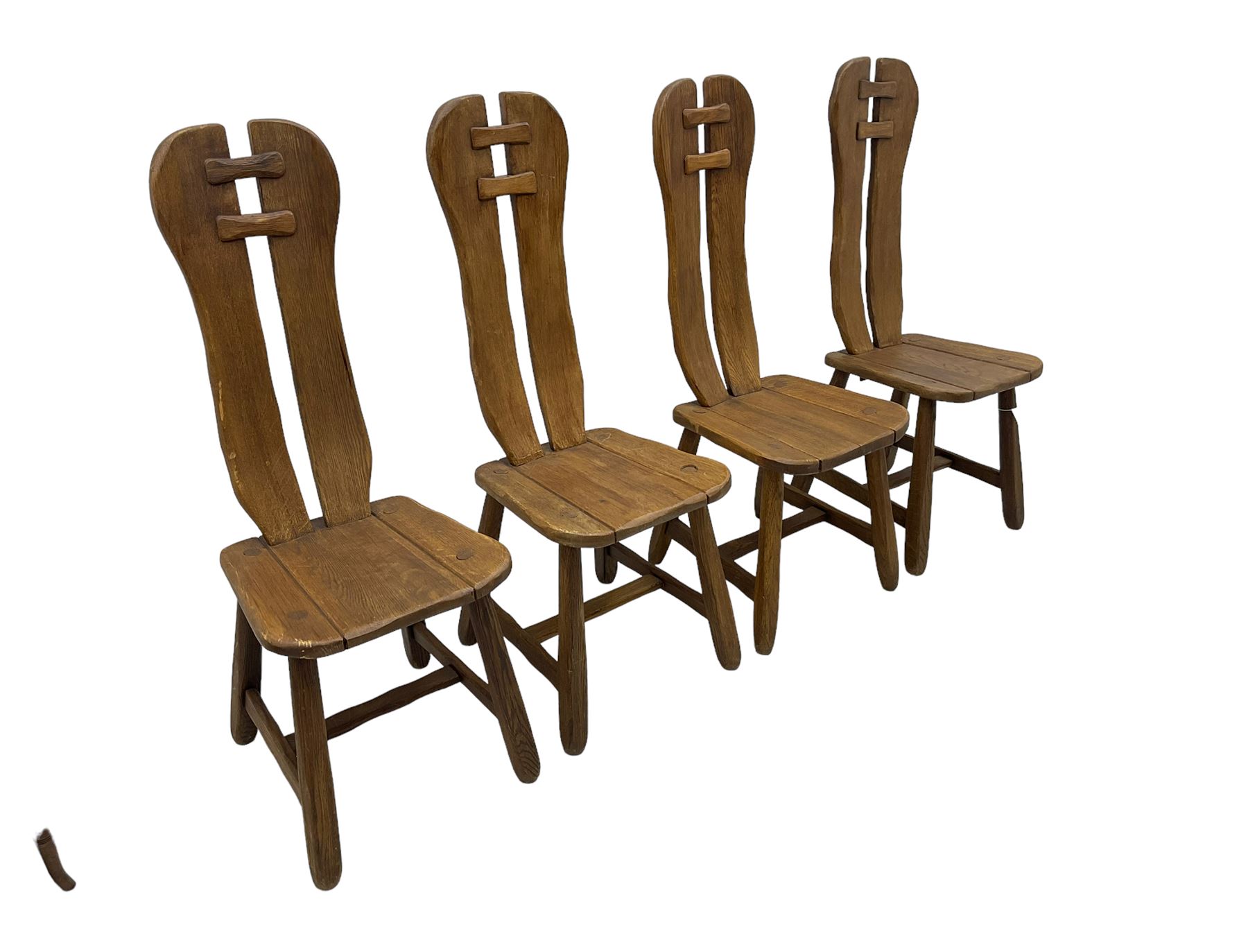 Attributed to De Puydt - set of four mid-century Brutalist oak dining chairs, twin slat back united by pegs, on square tapering supports united by H-stretcher 