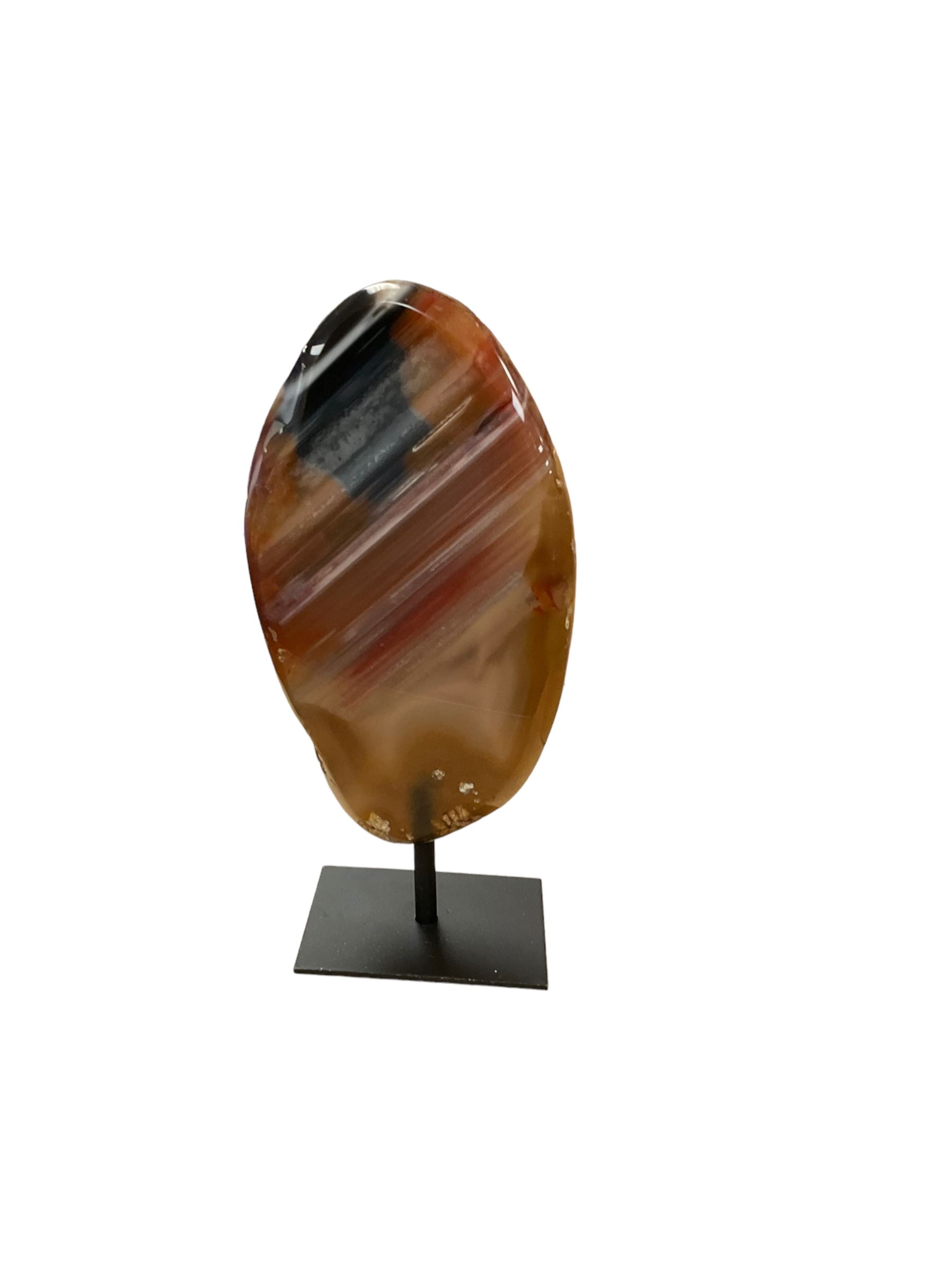 Agate crystal slice, raised on a black metal stand, H16cm