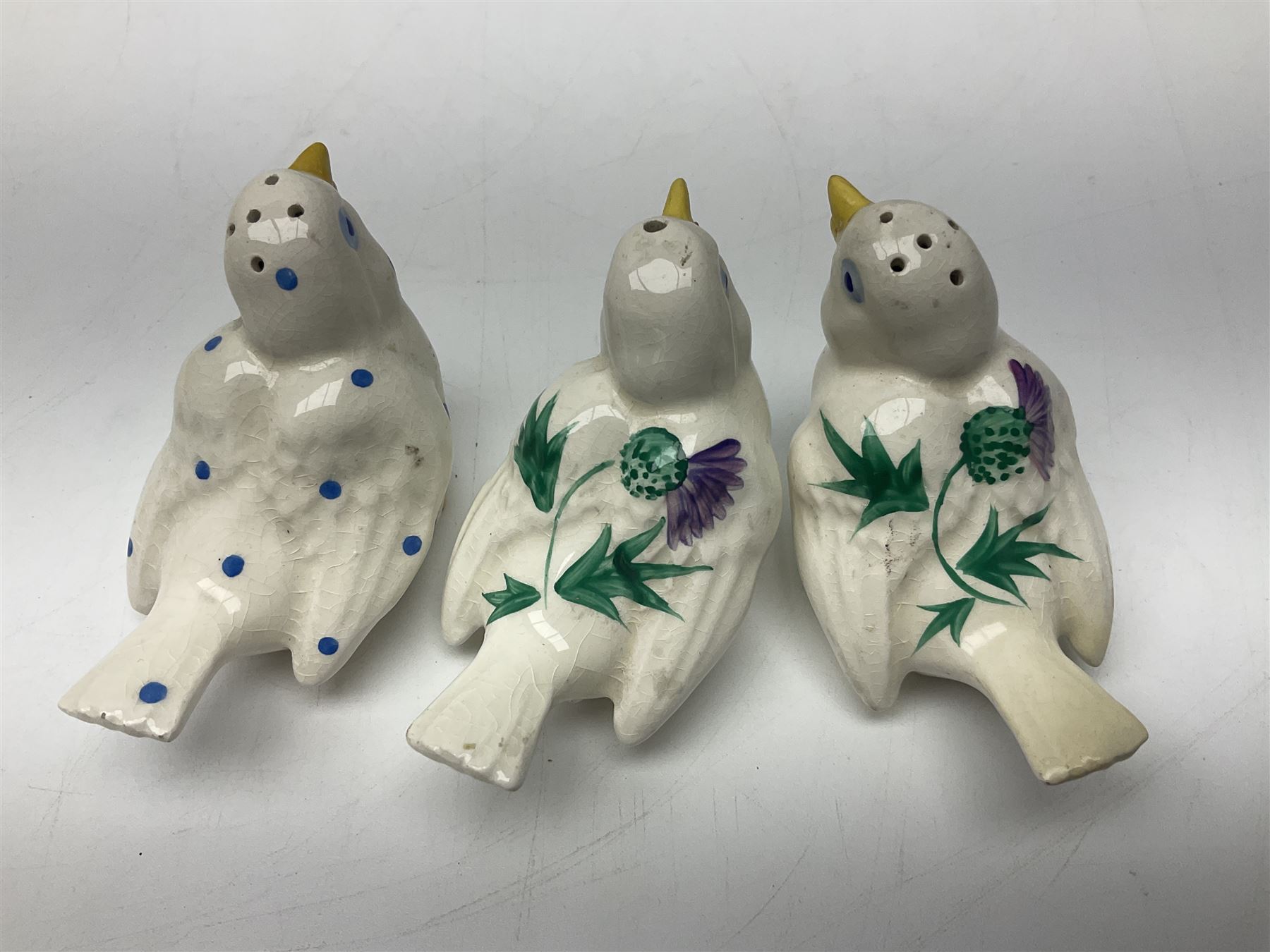 Three Plichta shakers modelled as birds