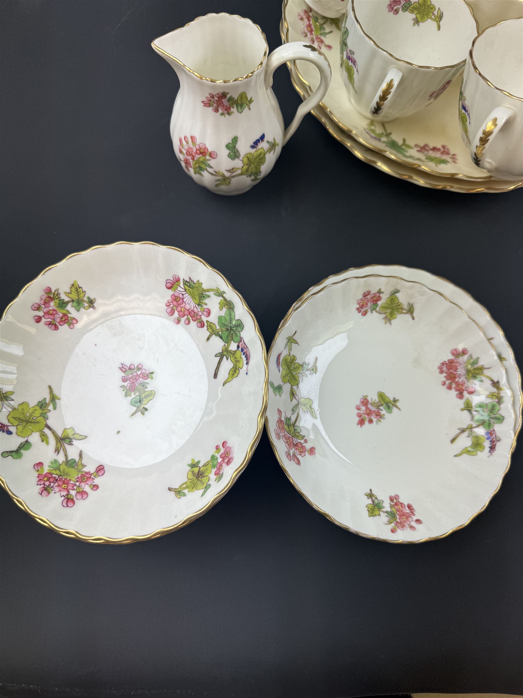 Coalport part tea service, decorated with floral sprigs, including eight cups and saucers, milk jug, eight dessert plates etc  