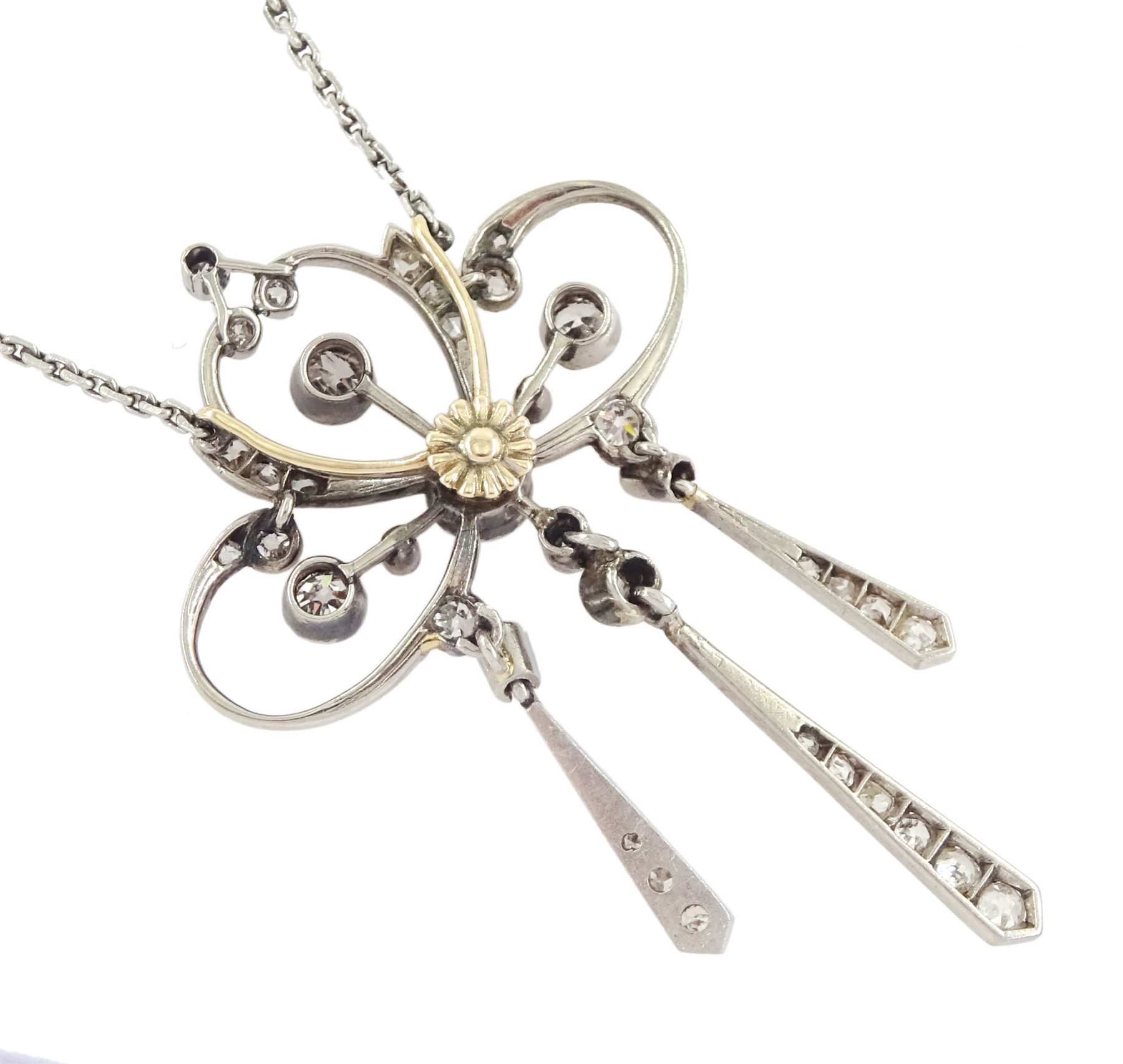 Early 20th century platinum and silver diamond pendant, four milgrain set old cut diamonds of approx 0.40 carat, with rose and old cut diamond set openwork surround, suspending three kite shaped pendants set with diamonds, on detachable screw back platinum trace link chain necklace