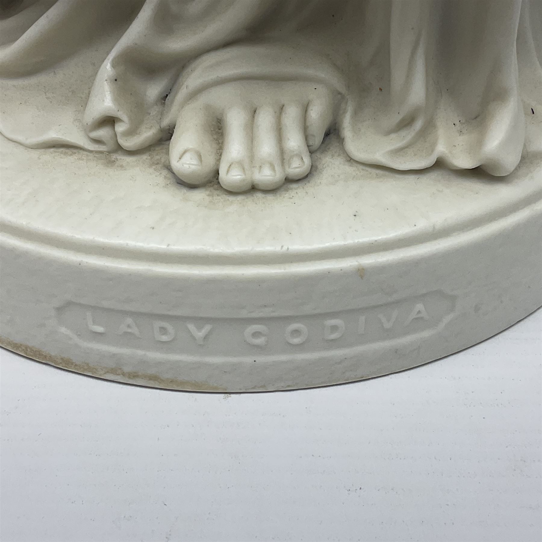 19th century Copeland Parian Ware figure, after R Monti, modelled as Lady Godiva, upon a circular titled plinth, signed and dated verso R Monti 1870, impressed to base Copyright Reserved Copeland, overall H22cm