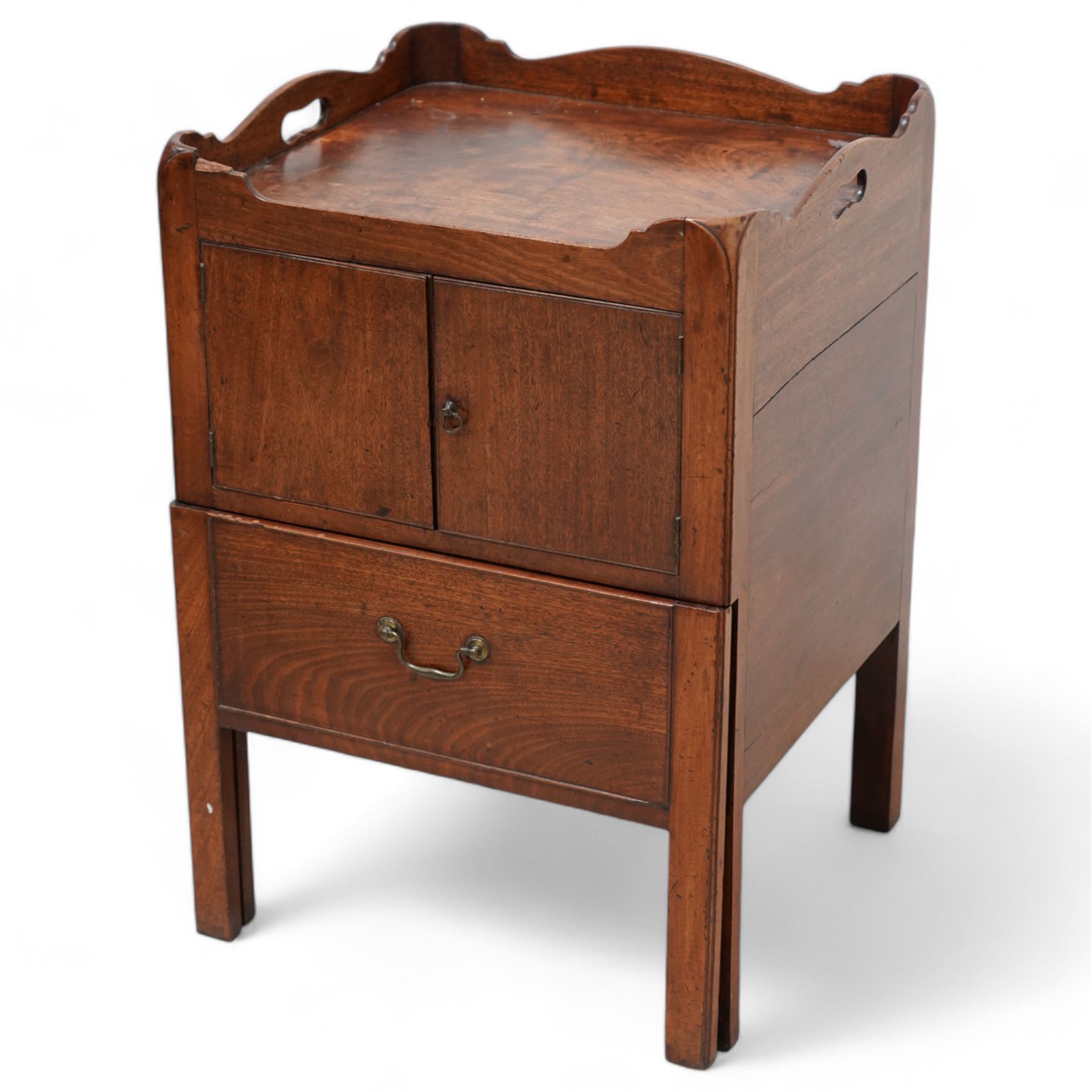 George III mahogany night commode, tray-top with pierced handles, fitted with cupboard over commode drawer, on square moulded supports