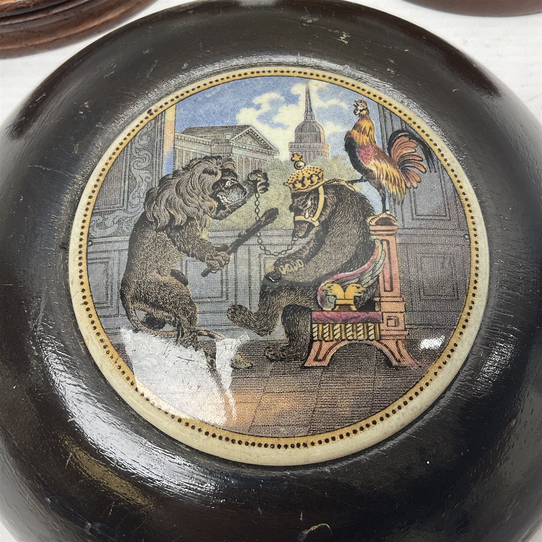 Six framed Prattware pot lids comprising 'Bear, Cock & Lion', 'Bear on Rock', 'Alas! Poor Bruin', ' Lady, Boy and Goats', 'The Shrimpers' and one other, largest D15.5cm (6)