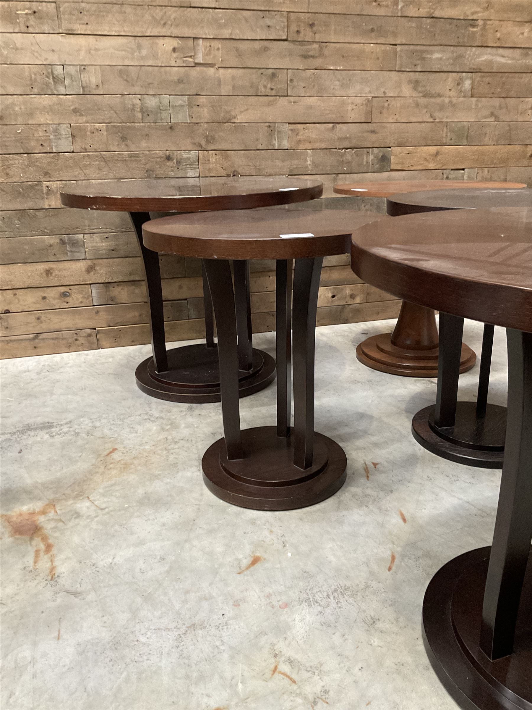 Circular walnut occasional table and four other circular tables