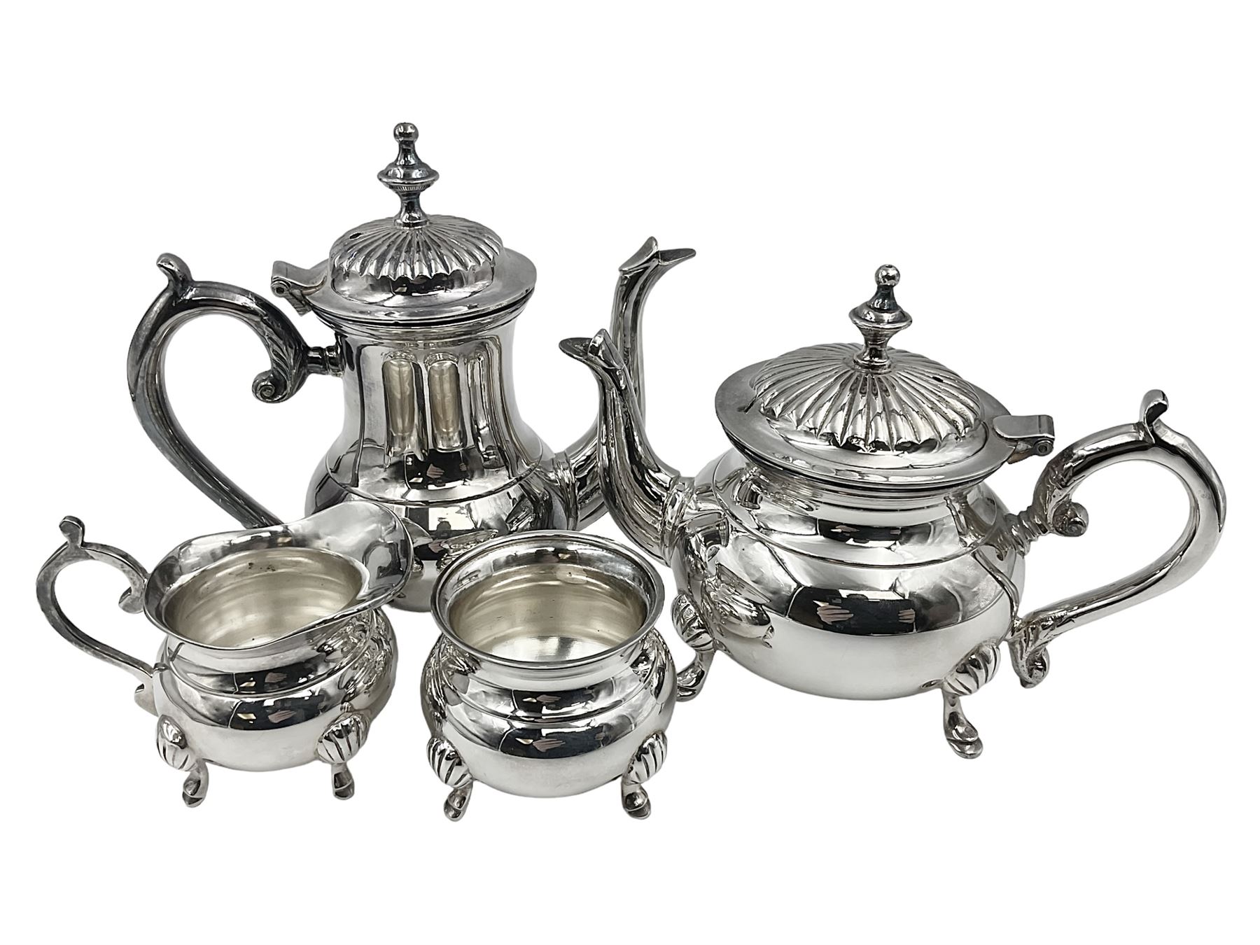 Miniature silver plated four piece tea service, comprising coffee pot, teapot, milk jug and sugar bowl, stamped GRC EPNS beneath, coffee pot H16cm