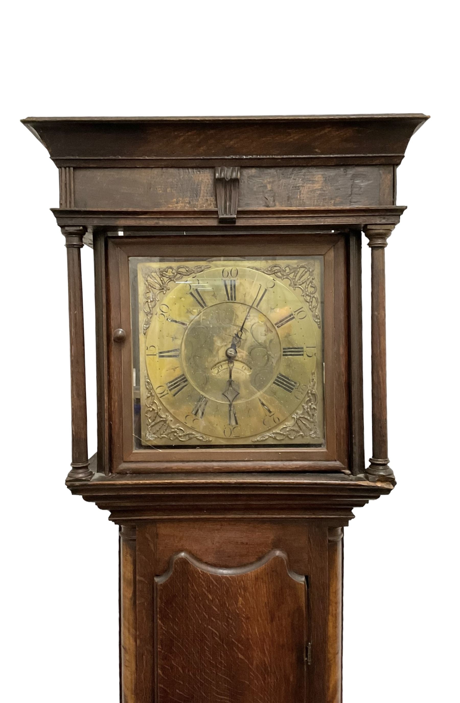 William Whipp of Rochdale - 30hr oak longcase clock c1790 with a flat topped pediment and blind frieze beneath, square hood door flanked by turned pilasters with wooden capitals,  trunk with recessed pillars and a wavy topped door, on a square plinth raised on bracket feet, brass dial with cast spandrels and an engraved dial centre, calendar aperture and matching steel hands, chapter ring with Roman numerals, five minute Arabic's and minute track, dial pinned to a chain driven movement with a countwheel strike. With weight and pendulum. 