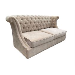 Grande wing back sofa bed, upholstered in beige buttoned fabric, metal action pull out double bed