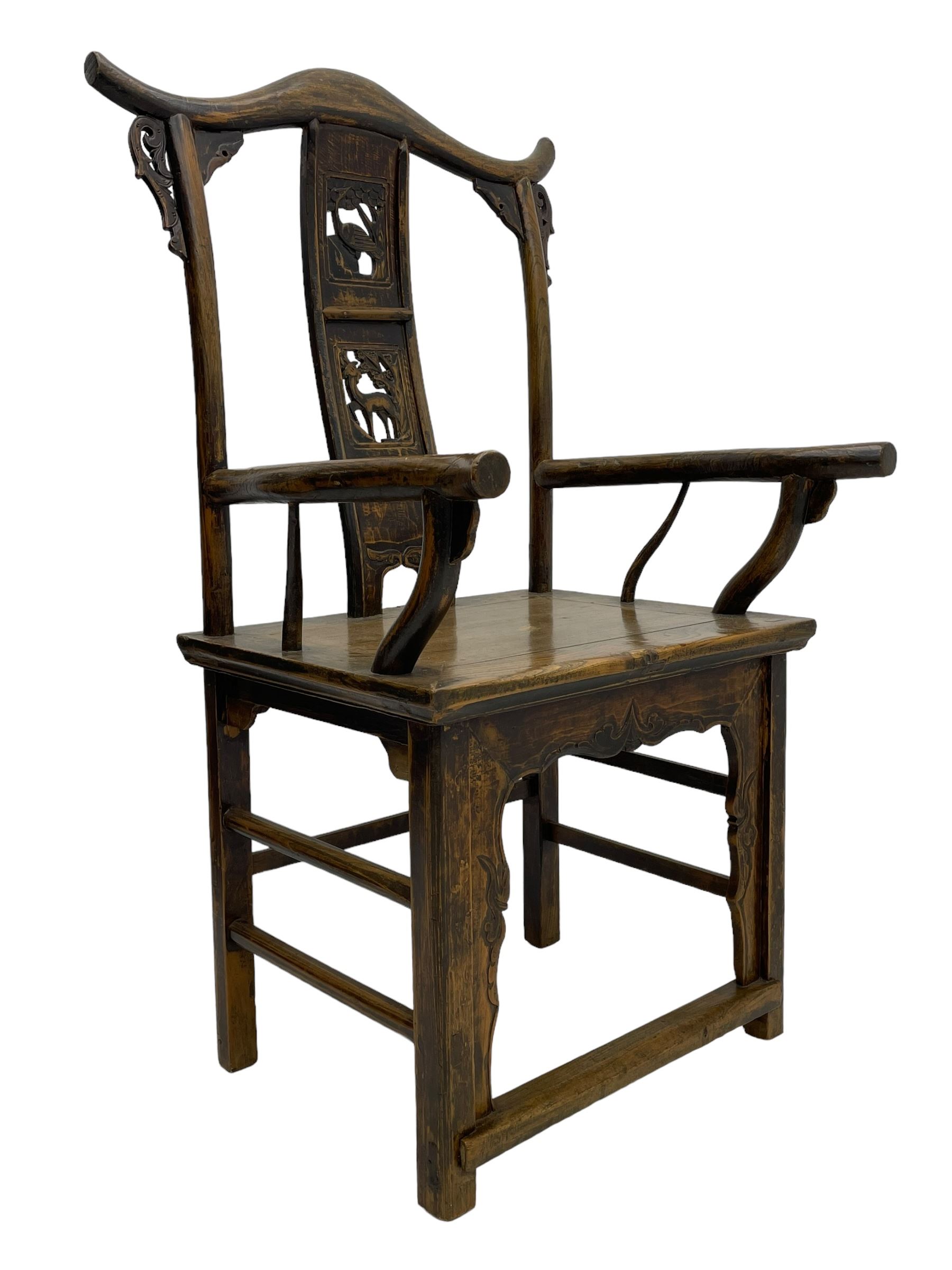 Chinese design elm yoke back 'official's' armchair, the shaped cresting rail over splat decorated with carved and pierced wildlife scenes, shaped projecting arms over rectangular seat, square supports united by plain stretchers, decorated with shaped frame brackets carved with foliage