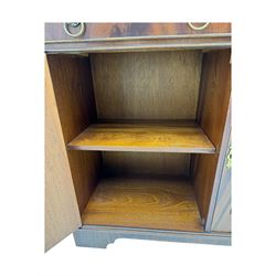 Georgian design mahogany bookcase on cupboard, projecting moulded and dentil cornice, two display cabinets enclosed by glazed doors above over three drawers and three cupboards, on bracket feet