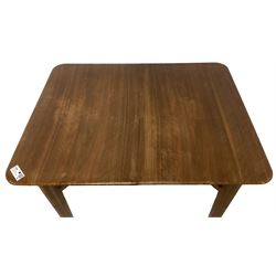 Mid-20th century teak extending dining table, rectangular top with rounded corners, raised on shaped tapering supports united by X-stretcher, with additional leaf