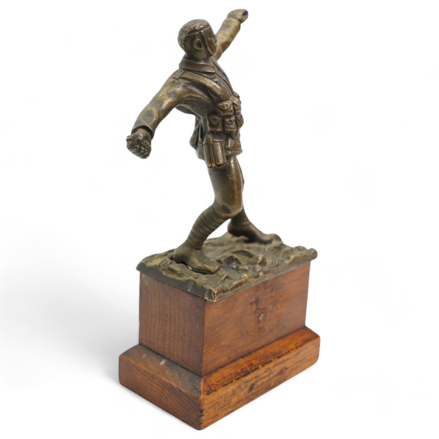 Sydney Wilkinson - bronze of a WWI soldier in the act of throwing a hand grenade, signed and on pine base H19cm 