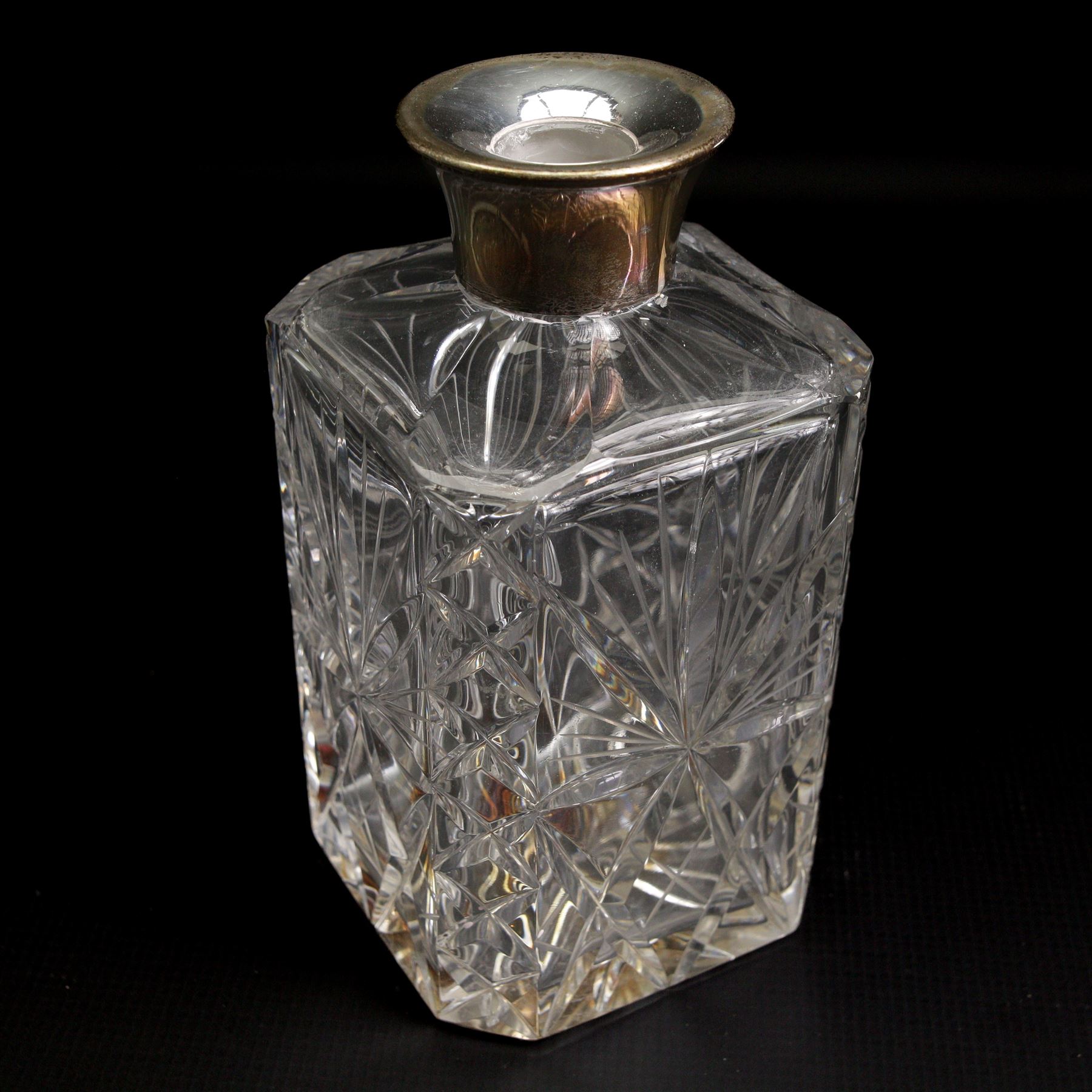 Square glass spirit decanter with silver collar and square stopper and two other decanters with silver collars (3)