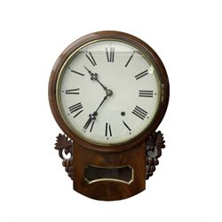 Late 19th century 8-day  drop dial wall clock in a mahogany case, carved ear pieces and glazed pendulum viewing glass, 12” painted dial with Roman numerals and Maltese steel hands, twin train going barrel movement striking the hours on a bell. No pendulum or key.