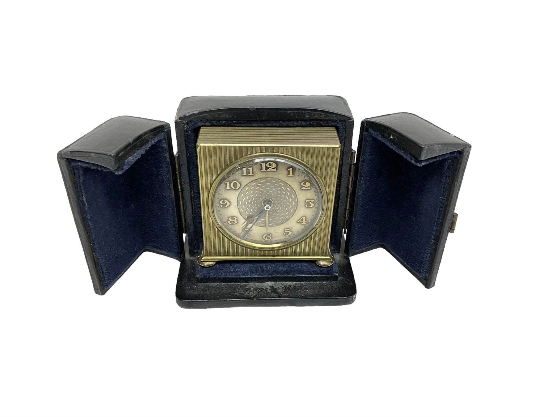 Two 20th century compact traveling alarm clocks -  in blue case with opening doors and an Equity travel clock, both wound and set from the rear.