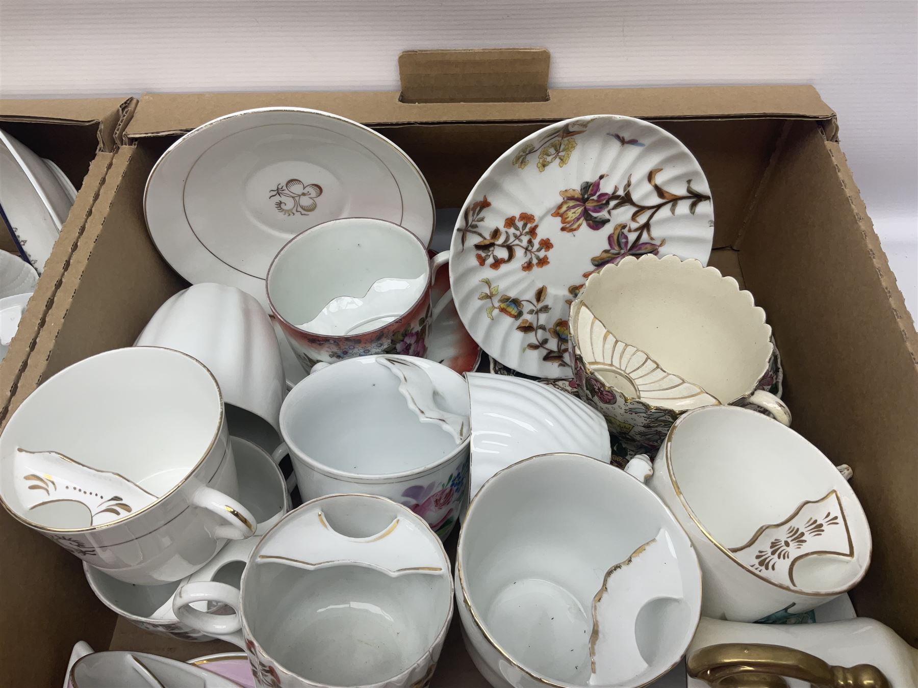 Collection of 19th century and later moustache cups, mostly with matching saucers, including hand painted examples