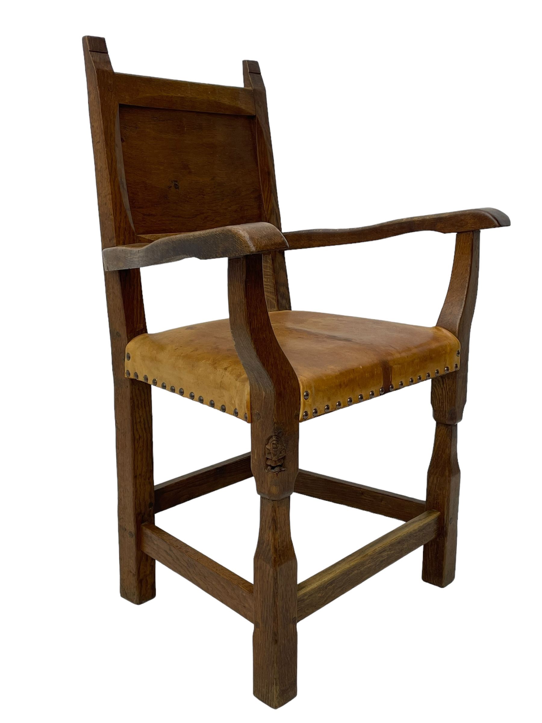 Gnomeman - set of eight (6+2) oak dining chairs, adzed panelled back over tan leather upholstered seat with applied stud band, on square supports united by plain stretchers, each chair carved with gnome signature, by Thomas Whittaker, Littlebeck, Whitby