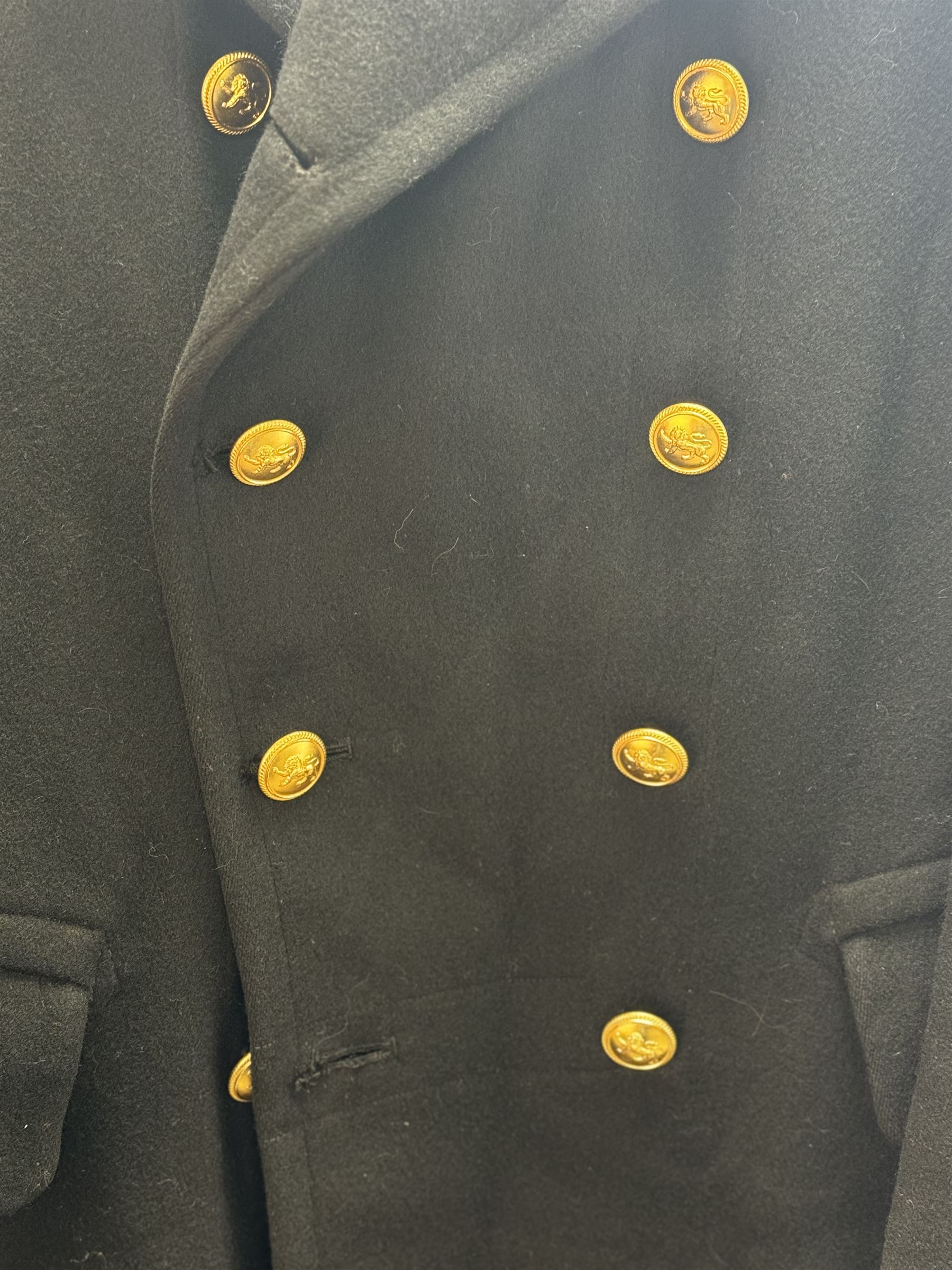 Royal Navy Lieutenant's Frock Coat by Haycock and Jarman, together with other naval accessories, including four pairs of Captain's insignia, six pairs of Captain's shoulder boards, a Merchant Navy cap badge and a collection of other badges, buttons and shoulder boards 