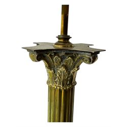 20th century brass standard lamp, Corinthian column stem on moulded square base with paw feet 