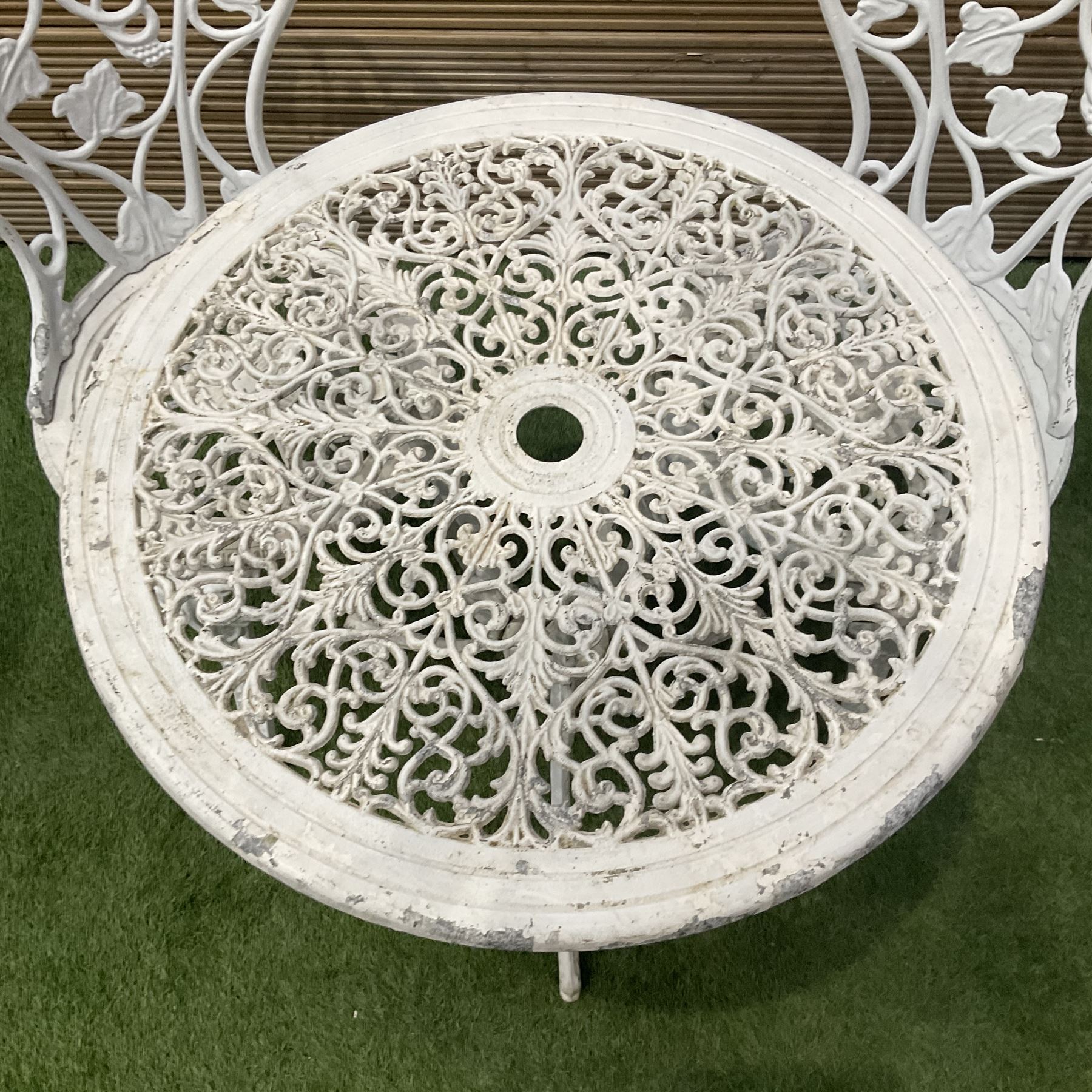 Cast aluminium white painted garden table and two chairs  - THIS LOT IS TO BE COLLECTED BY APPOINTMENT FROM DUGGLEBY STORAGE, GREAT HILL, EASTFIELD, SCARBOROUGH, YO11 3TX