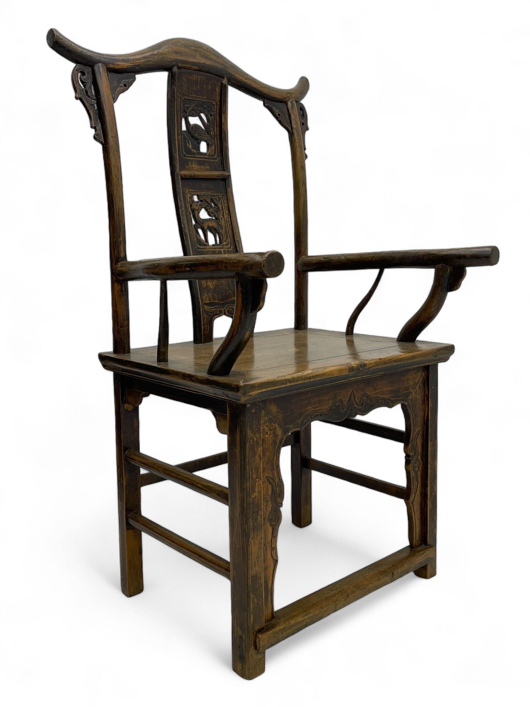 Chinese design elm yoke back 'official's' armchair, the shaped cresting rail over splat decorated with carved and pierced wildlife scenes, shaped projecting arms over rectangular seat, square supports united by plain stretchers, decorated with shaped frame brackets carved with foliage