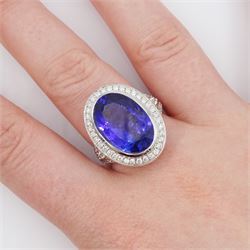 18ct white gold oval cut tanzanite and round brilliant cut diamond ring, with diamond set shoulders, tanzanite approx 8.85 carat, total diamond weight 0.81 carat