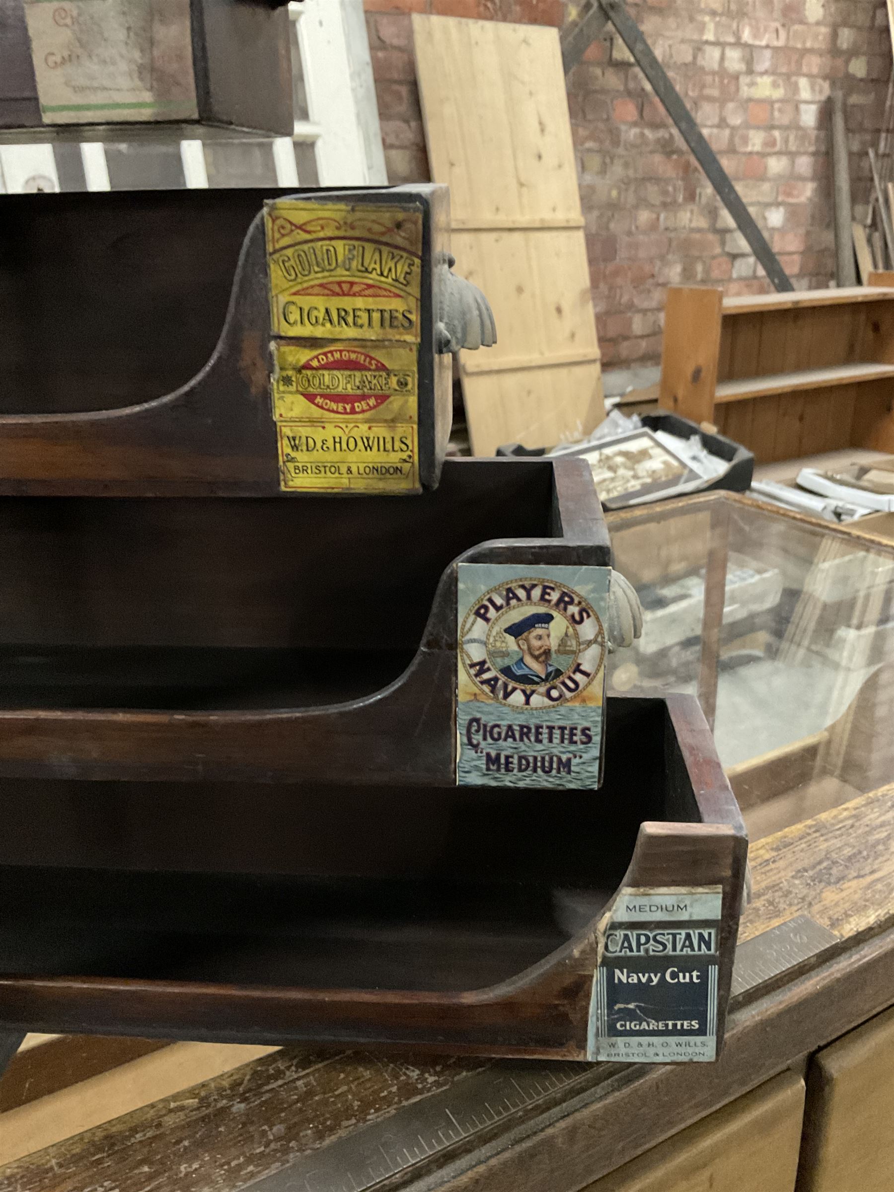 Early 20th stained pine and glazed wall mounting cigarette shop display cabinet, fitted with six sliding drawers with divisions and scalloped handles  - THIS LOT IS TO BE COLLECTED BY APPOINTMENT FROM THE OLD BUFFER DEPOT, MELBOURNE PLACE, SOWERBY, THIRSK, YO7 1QY