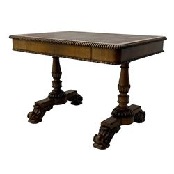 Early 19th century Regency rosewood writing table, rectangular top with inset leather writing surface and gadroon moulded edge, fitted with single frieze drawer, on twin turned pillar supports with lobe carved balusters, on platforms with beaded edge, acanthus scroll carved feet