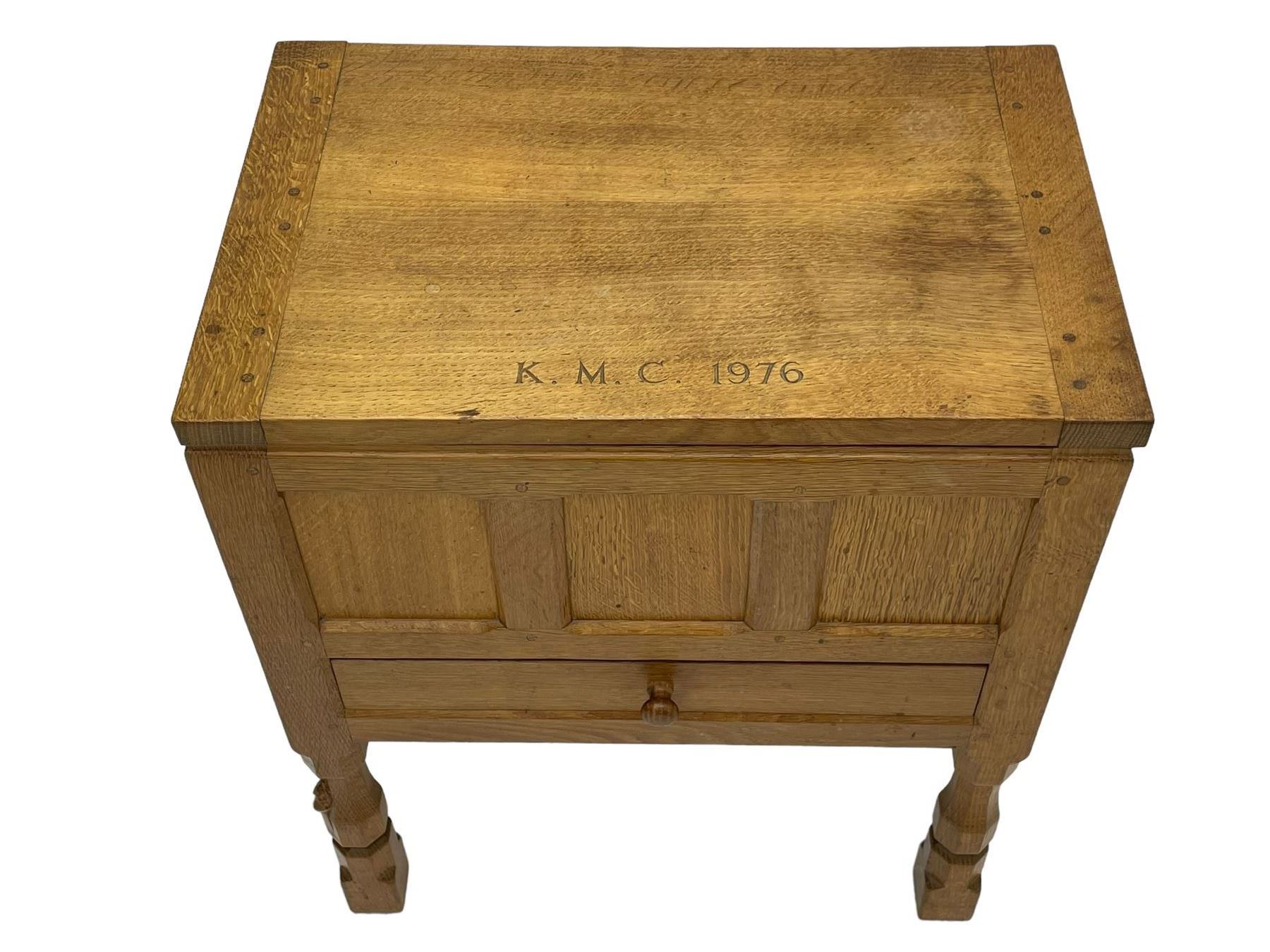 Mouseman - oak work or sewing box, rectangular adzed top inscribed 'L. M. C. 1976' enclosing vacant interior, triple panelled front and double panelled sides, fitted with single drawer, on octagonal supports, carved with mouse signature, by the workshop of Robert Thompson, Kilburn 