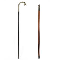 Novelty walking stick, the pommel cast as a man in uniform, together with a ebonised walki...