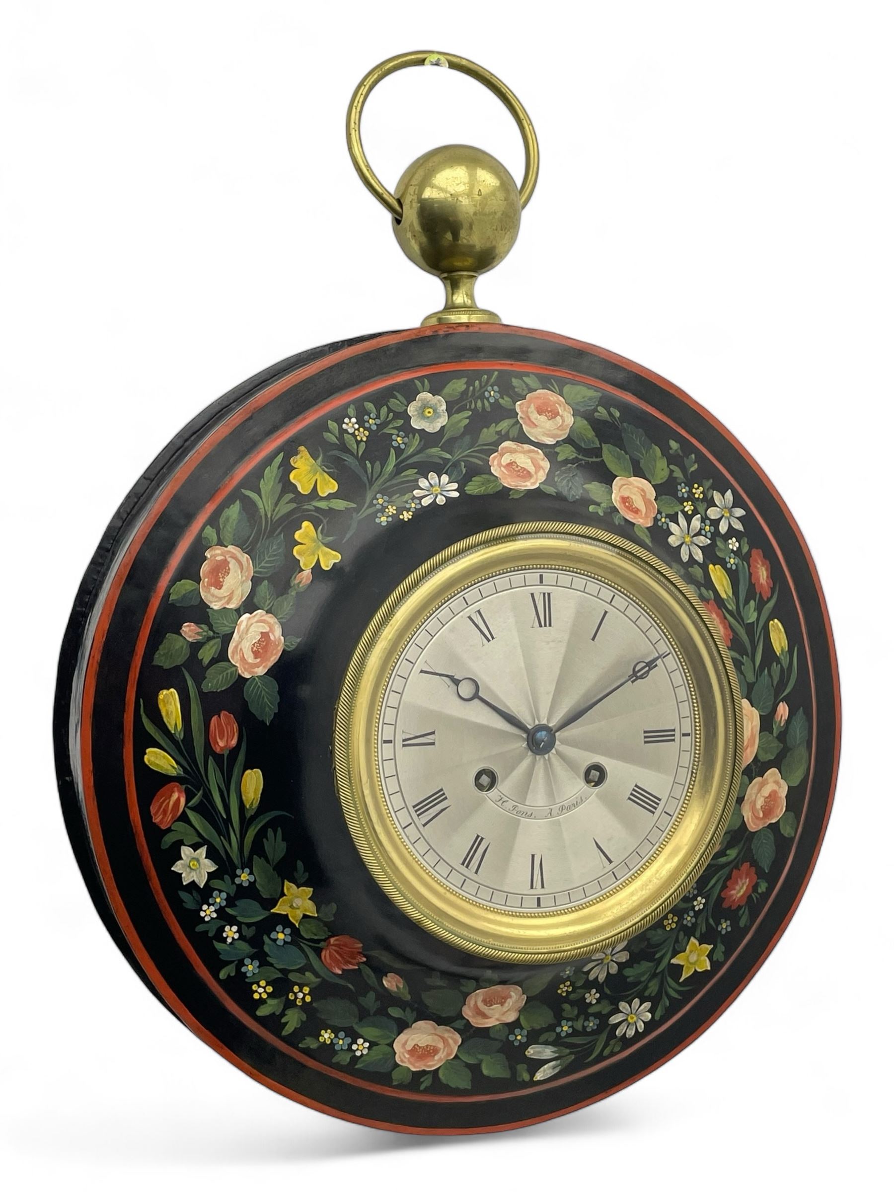 Honore Pons of Paris -  A good and early 19th century Tole Ware wall clock c1830, with a later re-decorated case suspended from a circular brass hanger, cast brass dial bezel and silvered engine turned dial with roman numerals, minute track and steel moon hands, 8-day twin train countwheel striking movement with a silk suspension, striking the hours and half hours on a bell. With pendulum and key.
