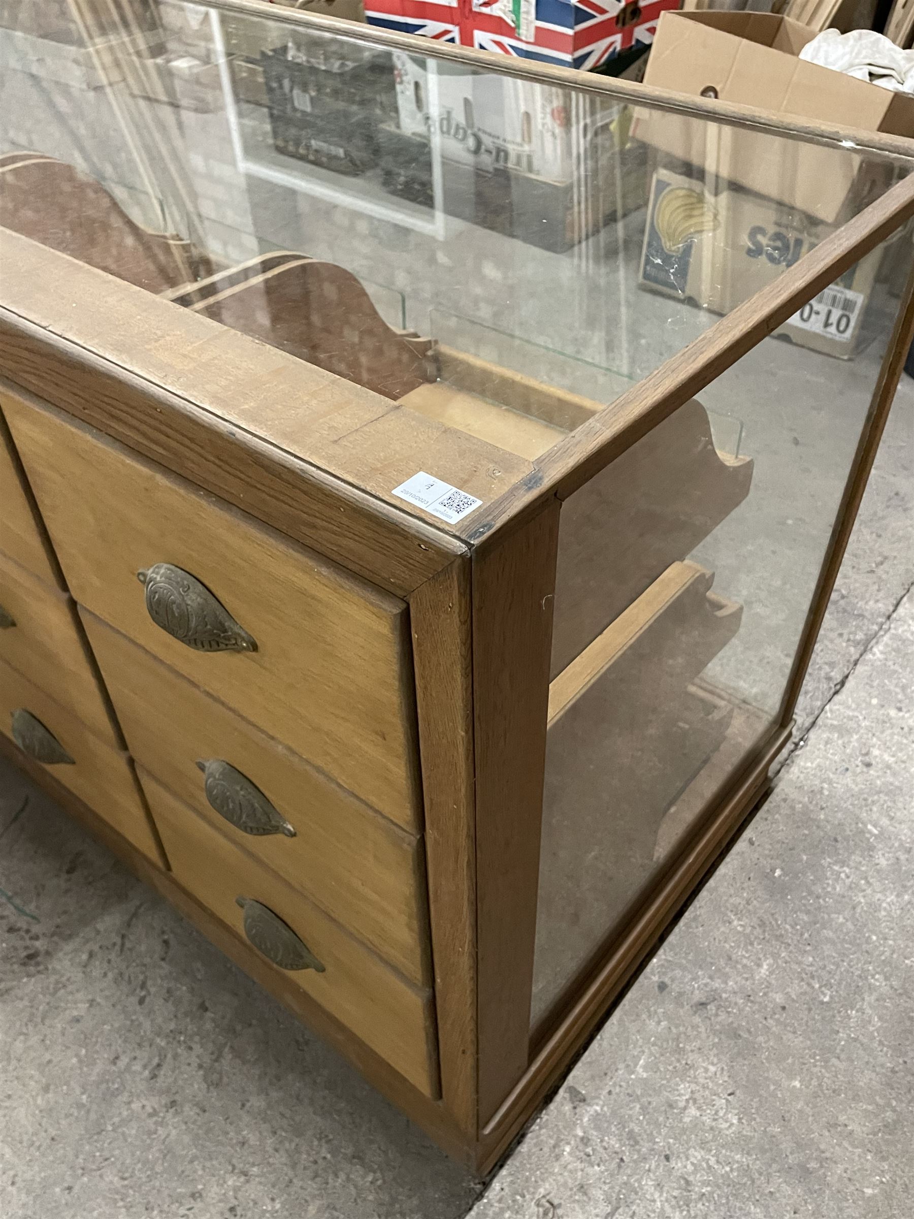 20th century oak and glazed haberdashery shop's display cabinet, fitted with twelve slides, on skirted base - THIS LOT IS TO BE COLLECTED BY APPOINTMENT FROM THE OLD BUFFER DEPOT, MELBOURNE PLACE, SOWERBY, THIRSK, YO7 1QY