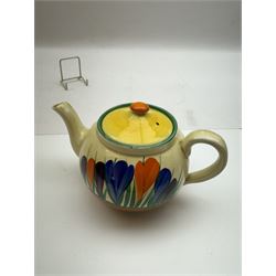 Clarice Cliff Bizarre 'Crocus' pattern teapot, H10cm, together with a Clarice Cliff Bizarre 'Crocus' pattern plate, D23cm, each with Crocus and Bizarre marks beneath, (2)