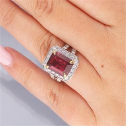 18ct white gold emerald cut rubellite tourmaline and round brilliant cut diamond cluster ring, with diamond set shoulders, hallmarked, rubellite 4.05 carat, total diamond weight 1.24 carat 