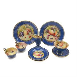 Wedgwood tea set for two, decorated with a still life of fruit by R Holland, within a powd...