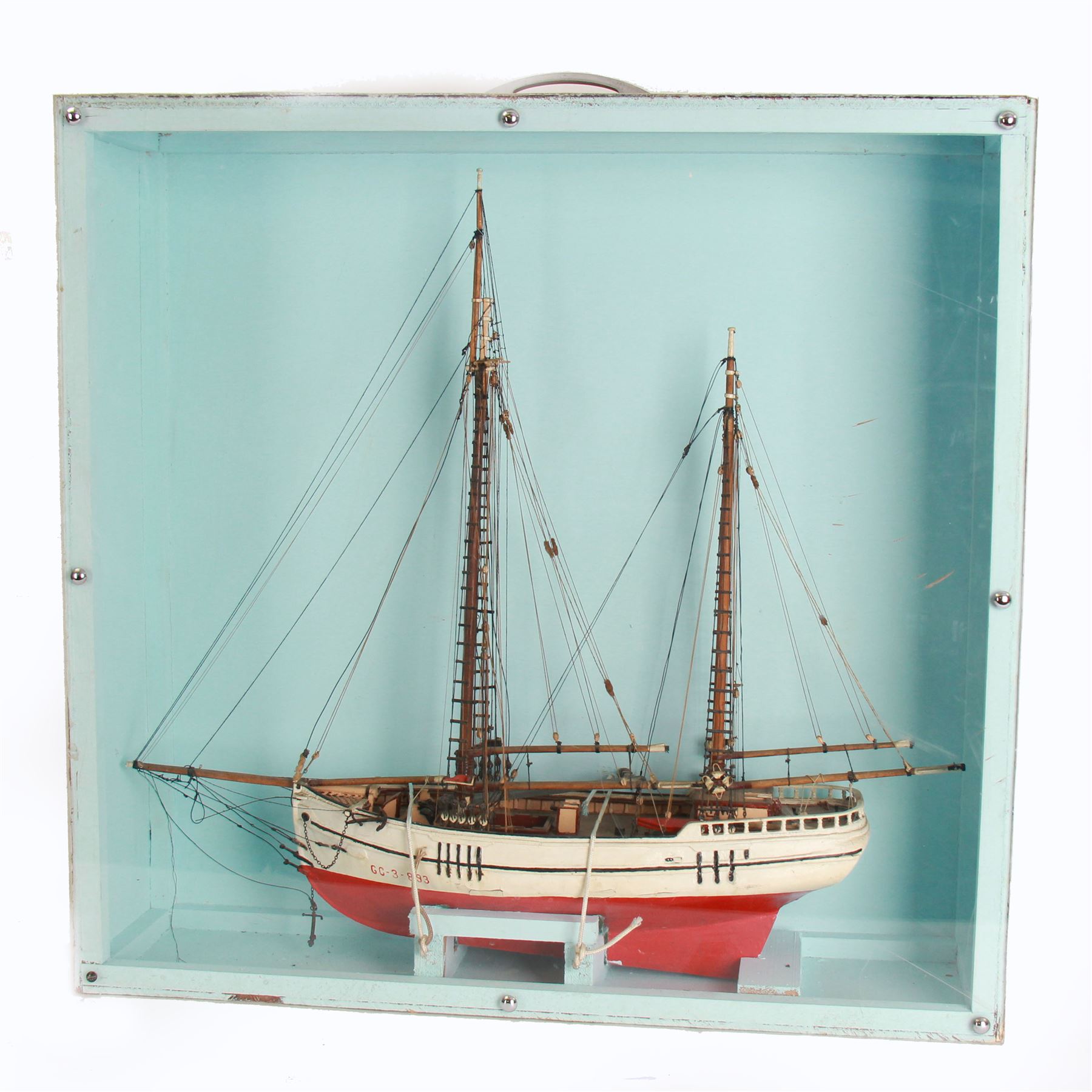 Scratch built model of a two-masted schooner, the red and white painted wooden body numbered GC-3-893, contained within wooden case, the interior painted in a light blue, with carry handle, excluding handle case H64.5cm, W67cm