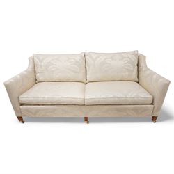 Duresta - Grande hardwood-framed three-seat sofa, upholstered in pale fabric decorated with repeating foliate pattern, on square tapering supports with brass castors 