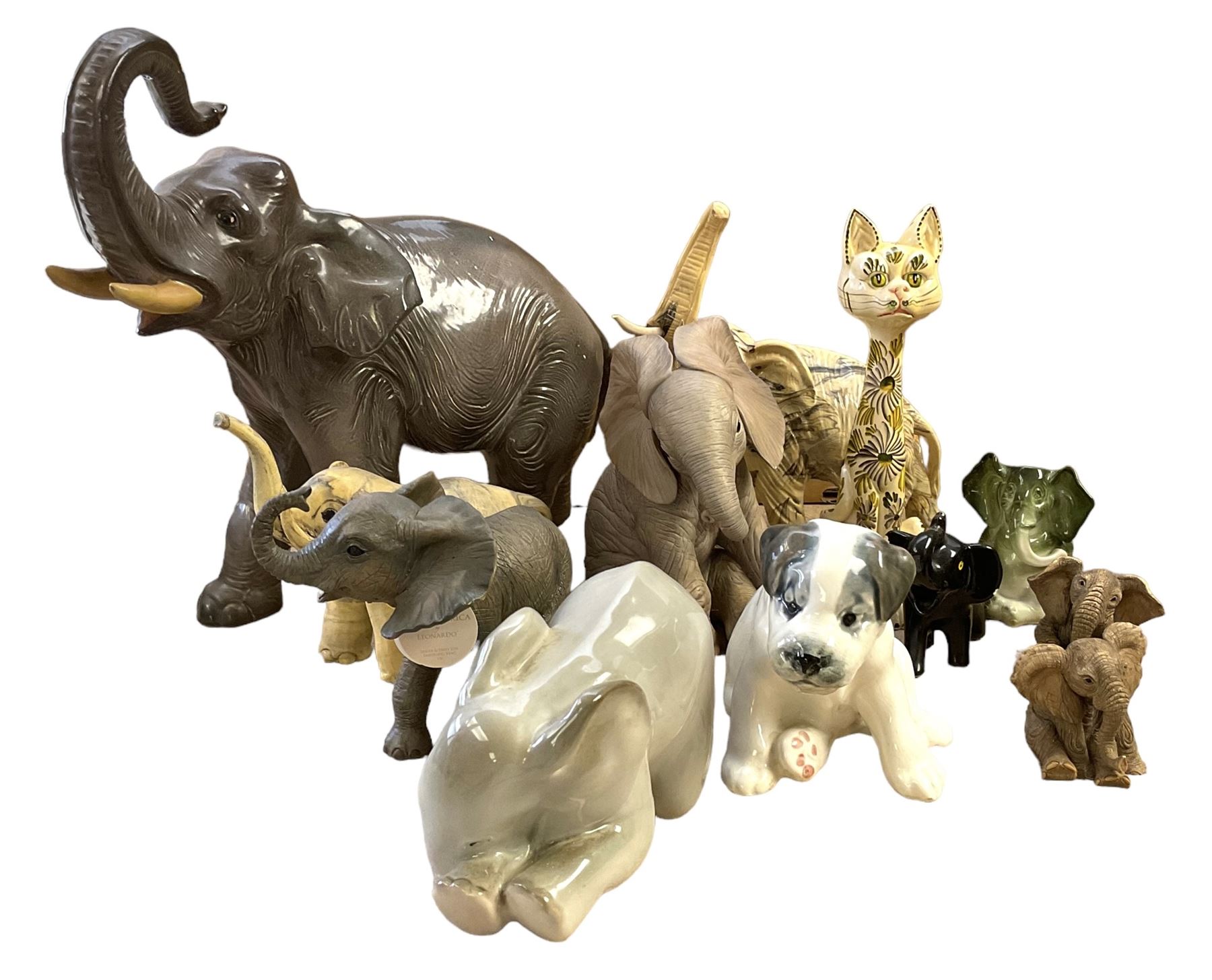 Group of ceramic and resin animal figures, mostly elephants, to include USSR model of a seated Terrier puppy, and a USSR model of a baby elephant, in one box