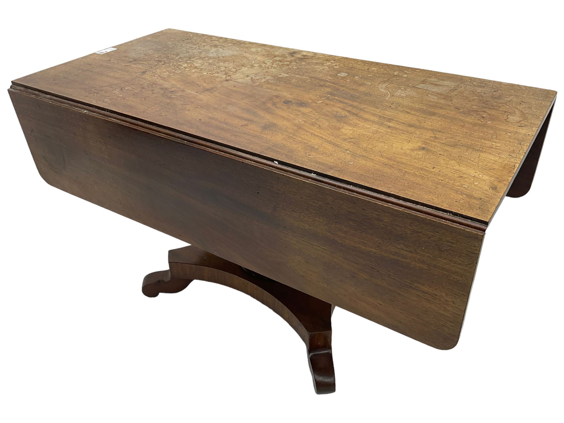 Victorian mahogany supper table, rectangular drop-leaf top with rounded corners, tapered octagonal column on concaved rectangular platform with splayed shaped feet