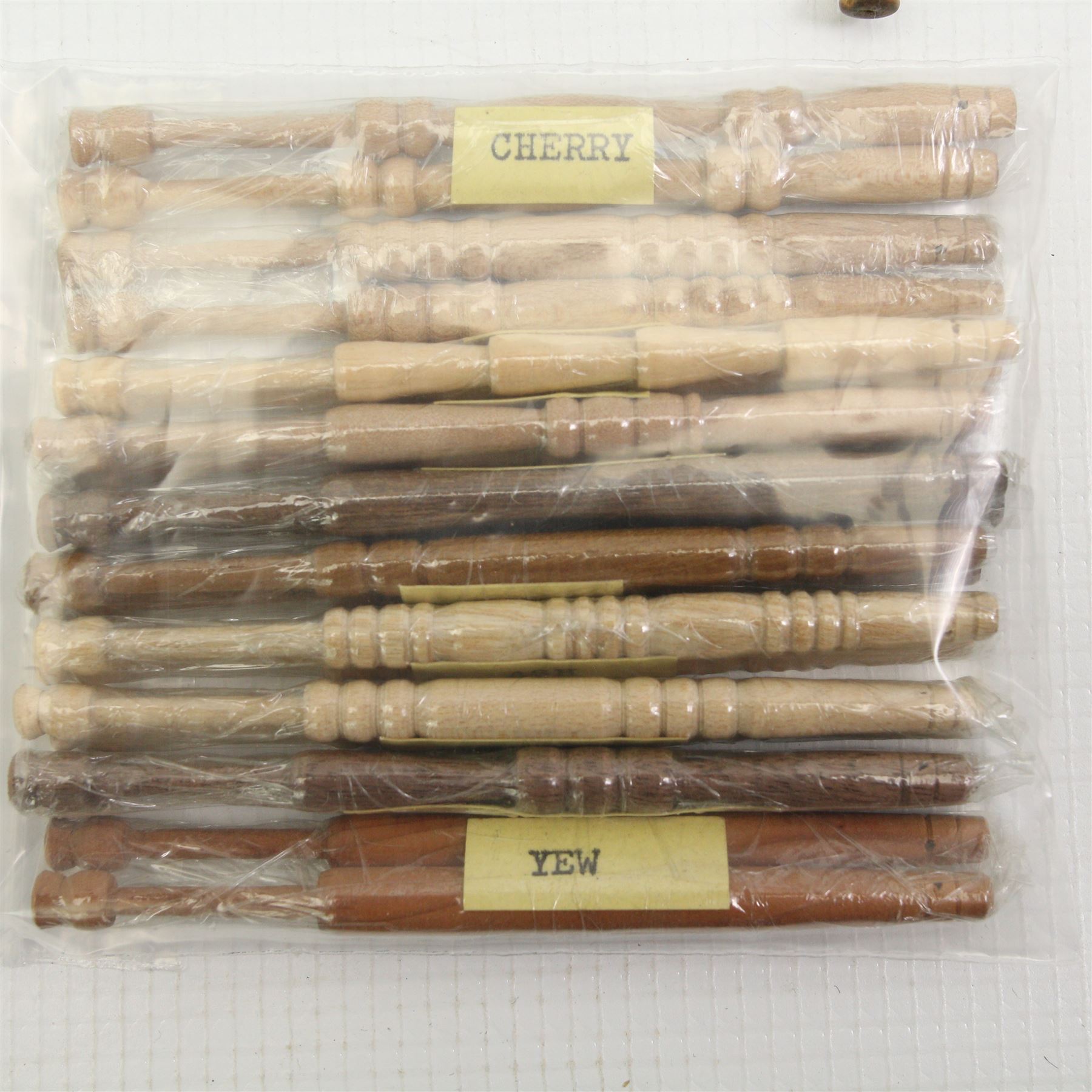 Collection of turned wooden lace maker's bobbins, including 19th century and later examples, two mother & babe carved bobbins etc, mostly with glass spangles (87 approx)