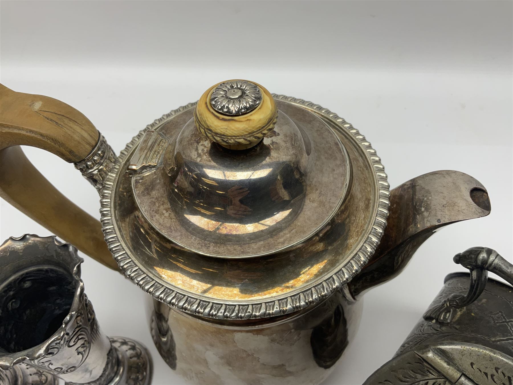 19th century silver plated coffee pot, of bellied form with fruitwood handle and finial, together with a silver plated novelty sugar bowl i the form of a coal scuttle and a pair of silver plated embossed vases, coffee pot H20cm