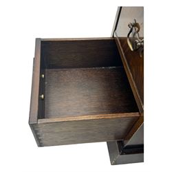 20th century mahogany twin pedestal desk, moulded rectangular top with red leather inset with gilt tooled border, central drawer over kneehole flanked by two banks of four graduating cockbeaded drawers, on plinth base