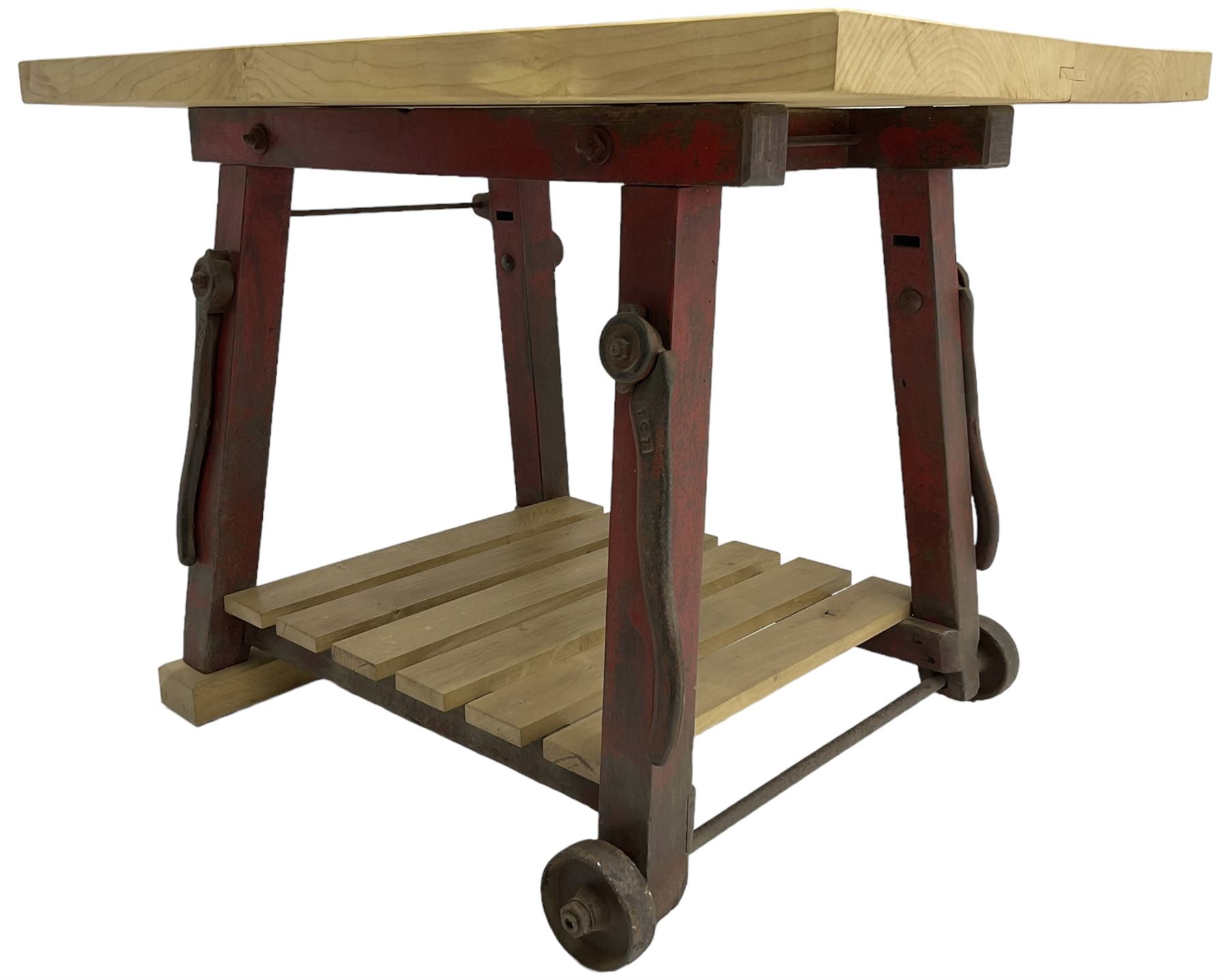 Kitchen island with rectangular maple top, on reclaimed machinery base with oak pot board, on block sledge feet