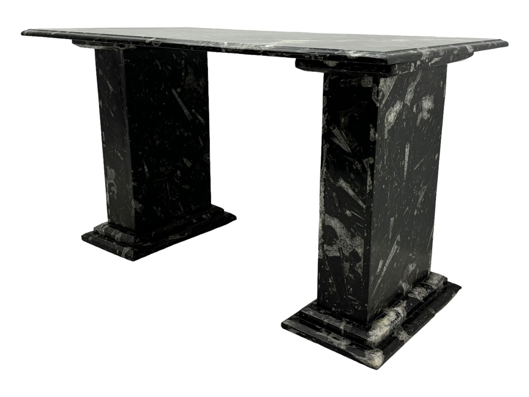 Marble hall table with orthoceras and goniatite inclusions, the rectangular top upon two rectangular stepped plinths, H78cm, L135cm, D77cm