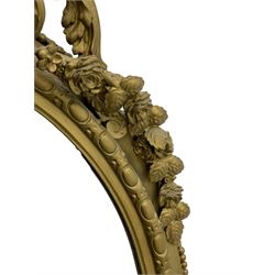 19th century giltwood and gesso girandole wall mirror, the raised pediment decorated with ribbon tie over curled acanthus leaves and flowerhead festoons, oval egg and dart moulded frame with outer bead, three projecting candle sconces in the form of scrolled acanthus leaves, lower shell motif with extending leaf decoration 