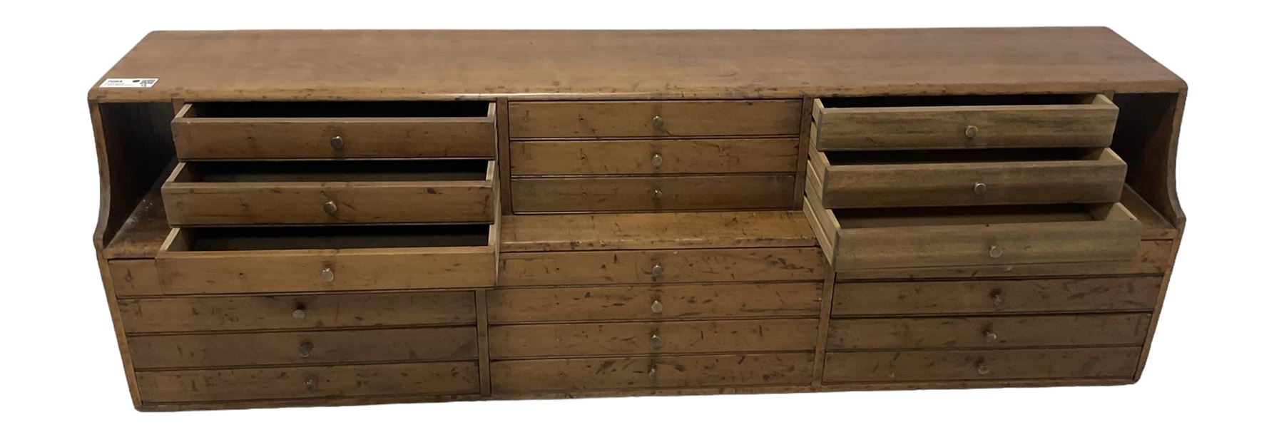 Late 19th century stained beech Solicitor's desktop bank of correspondence drawers, two-tiered, fitted with twenty one drawers, together with related brass plaques