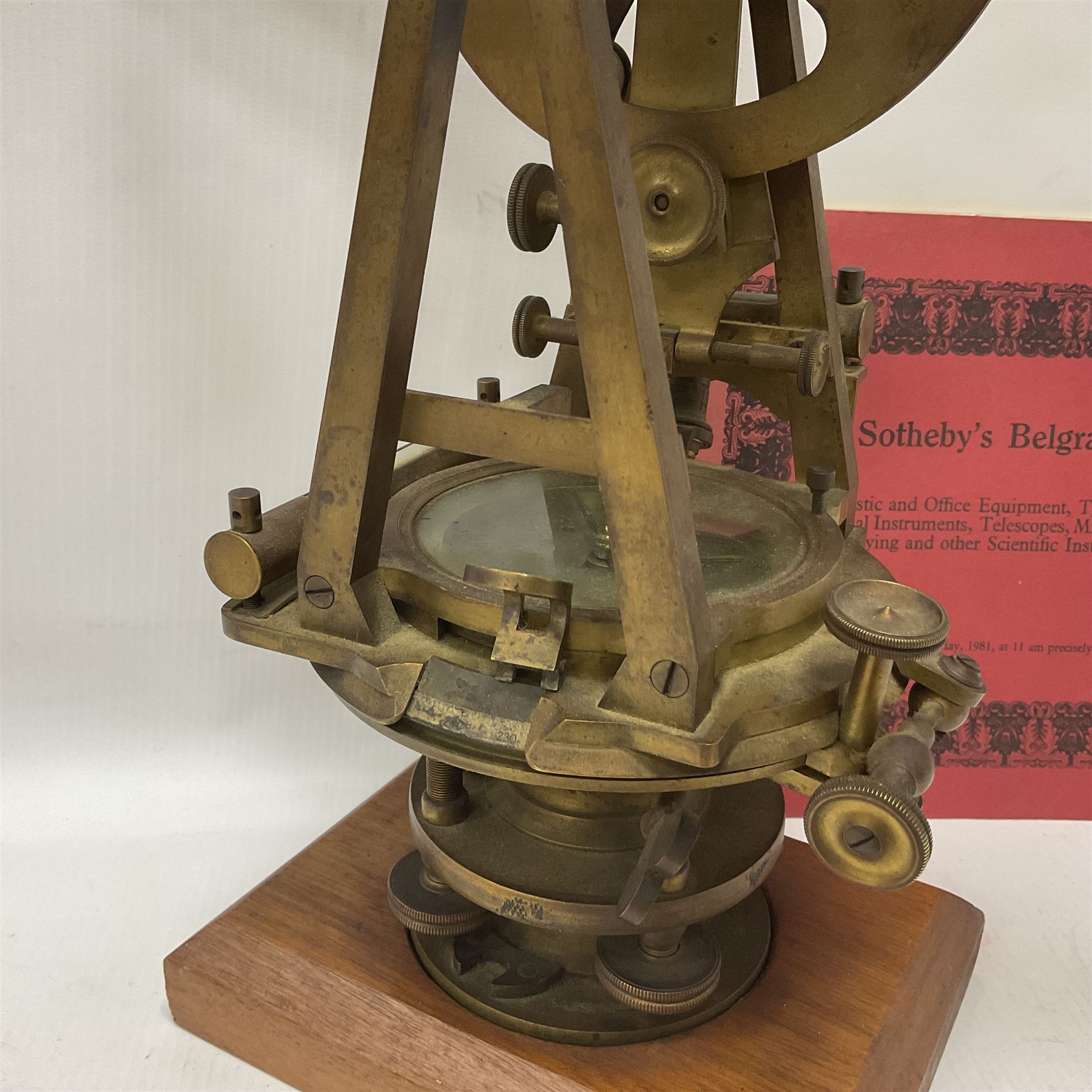 19th century brass transit theodolite by Troughton & Simms, the sighting telescope with rack and pinion focusing, above an inset compass, upon four levelling feet and a rectangular wooden base, including base H35.5cm