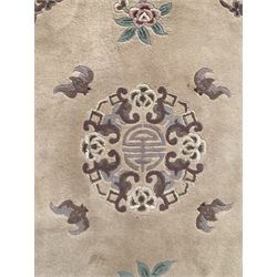 Chinese washed woollen rug, decorated with flowers and Chinese symbols 