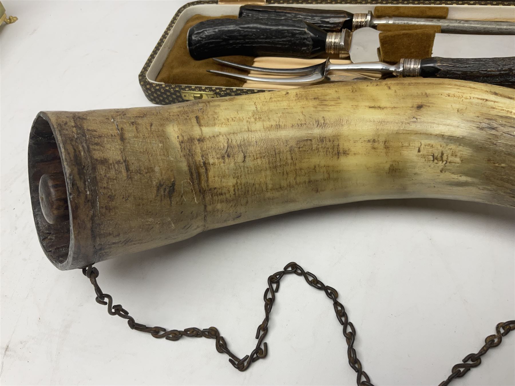 19th century horn powder flask, with chain handle, together with a cased antler handled carving set