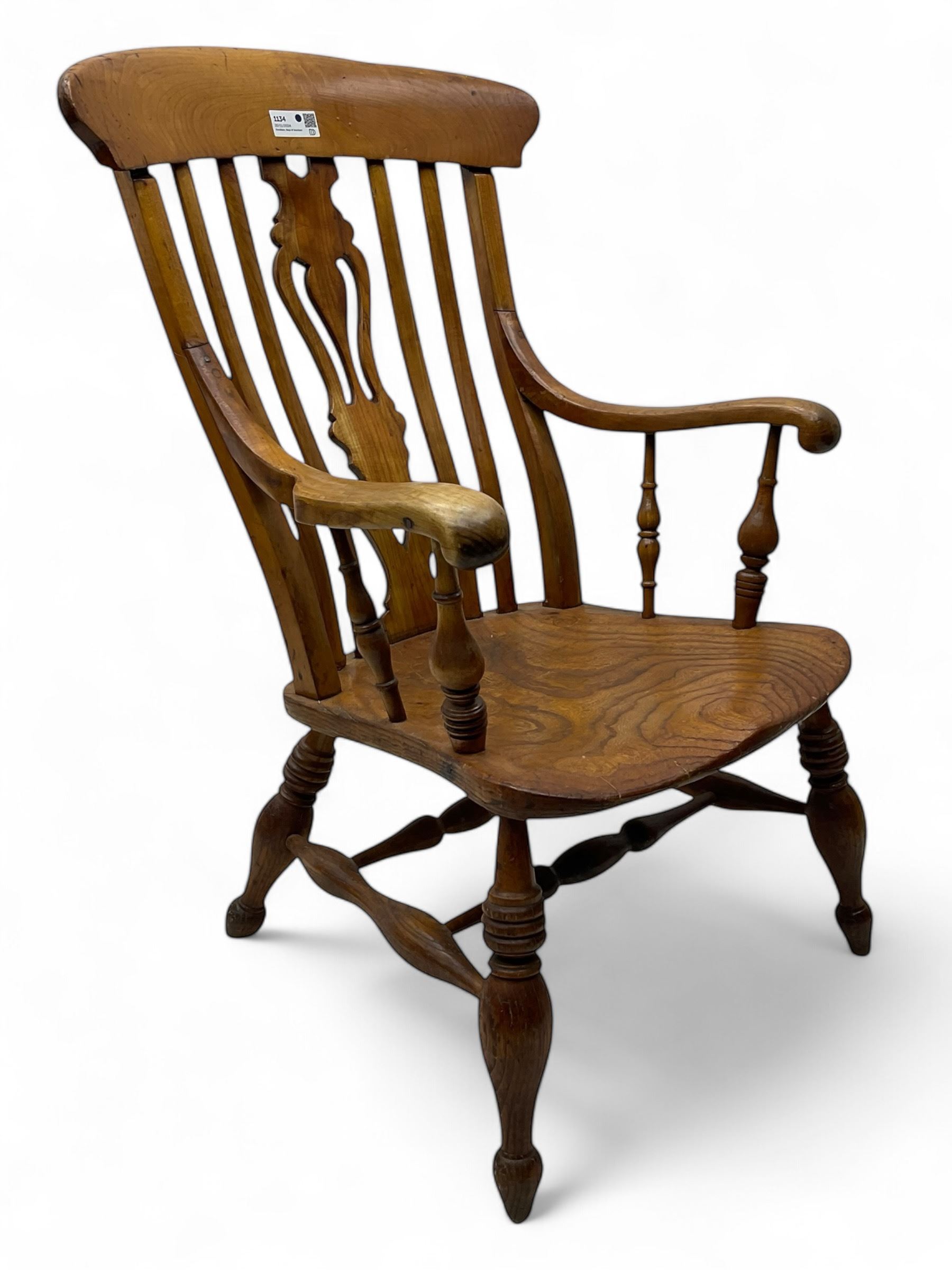 Late 19th century elm and ash comb-back Windsor chair, shaped back with pierced vase-shaped central splat and spindle supports, shaped saddle seat raised on turned supports united by H-stretcher